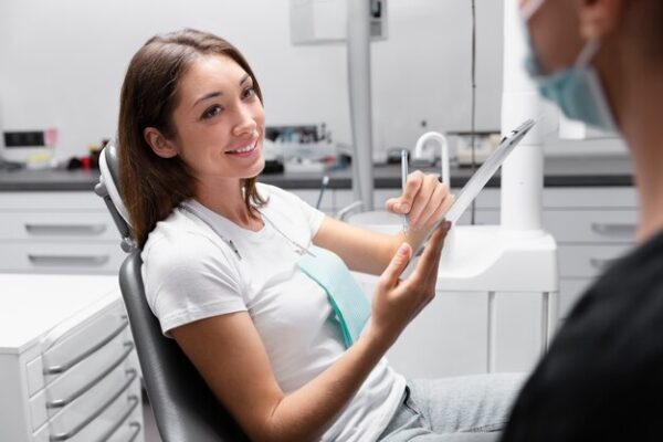 close-up-smiley-patient-dentist-checkup_23-2149164284-1941045